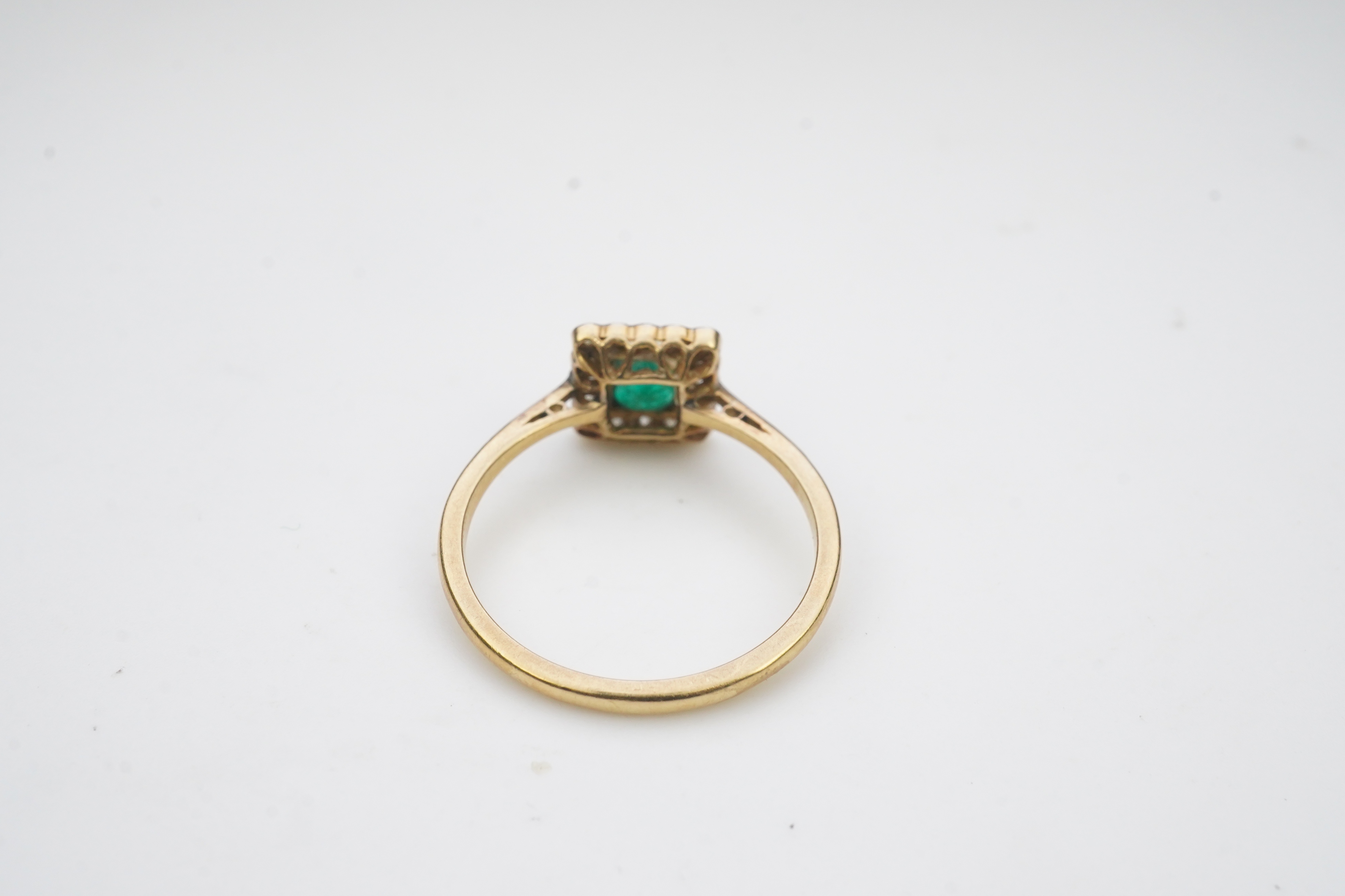 An emerald and diamond ring, early 20th century